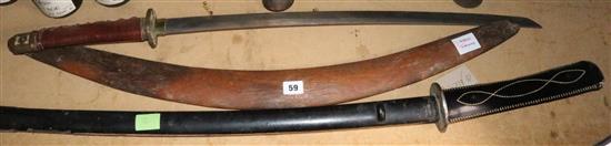 Two Japanese swords and a boomerang